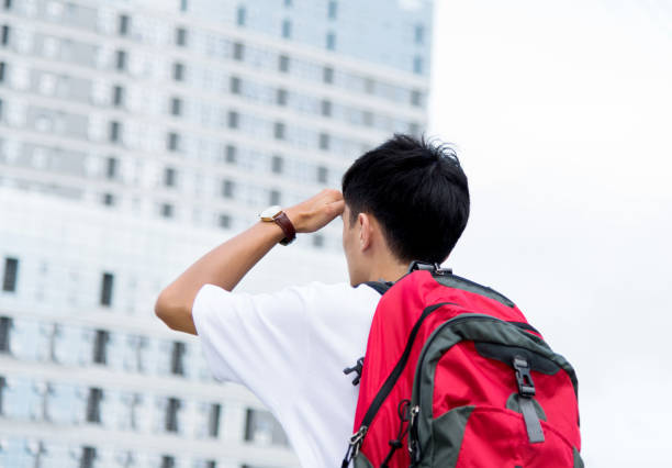 istock Young man in big city 956346668