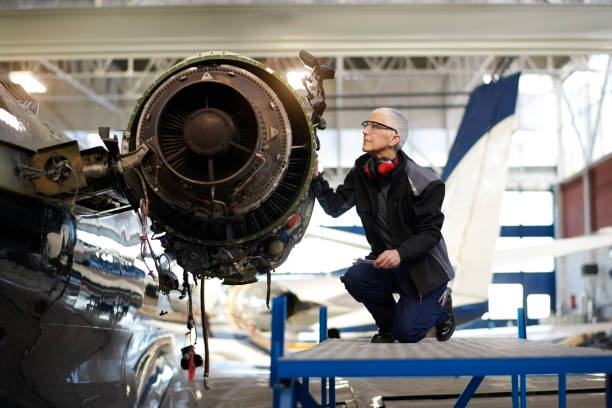 istock Aircraft mechnic in the hangar 956347722