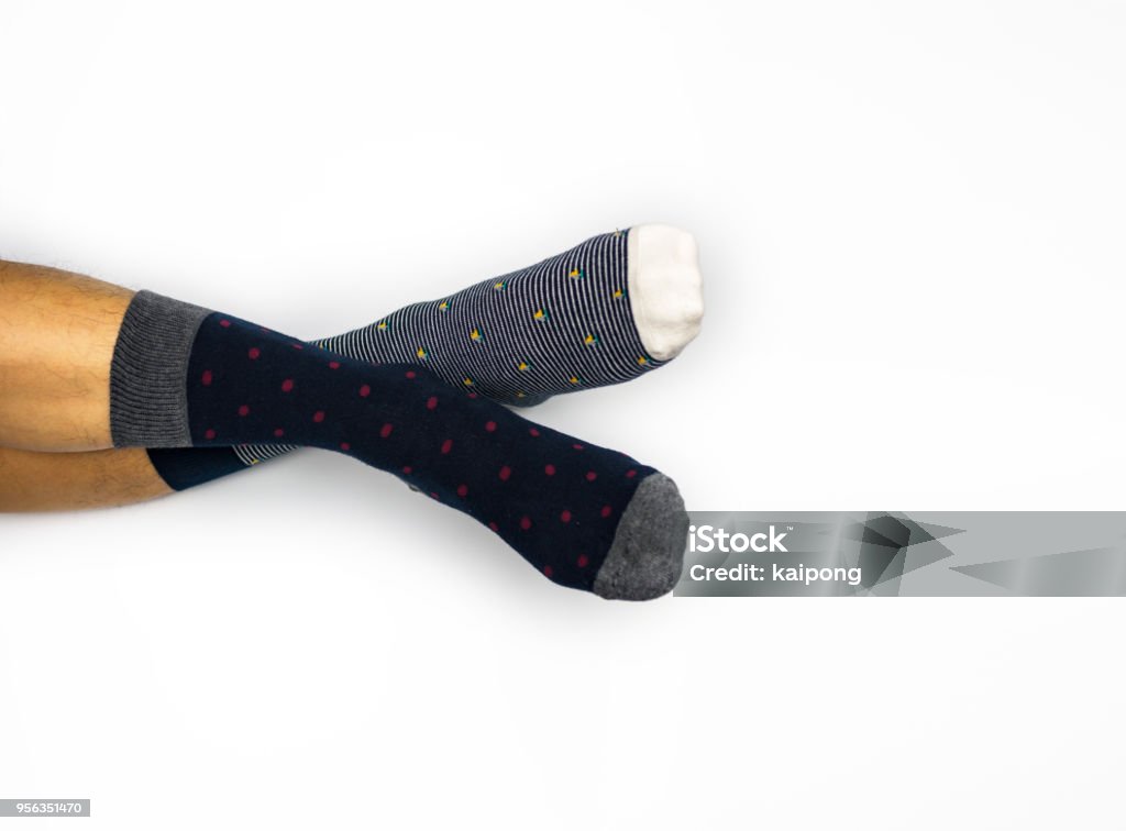 Wearing different pair of sock on white background Sock Stock Photo