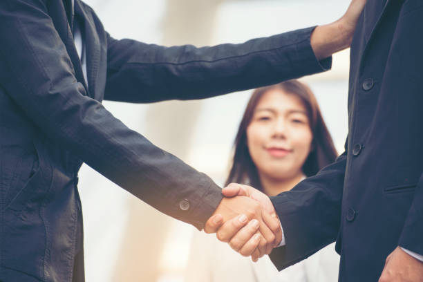 istock Teamwork Shake Hands together Partnership Concept. Trust business complete deal. 956352202