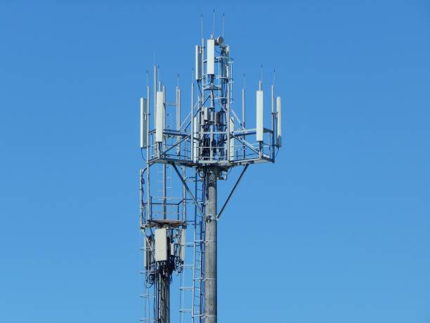 istock Communication antenna tower building with the sky background. Telecommunication aerial. Mobile phone communication antenna tower. 956353622