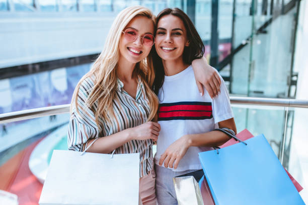 istock Girls at shopping center 956356364