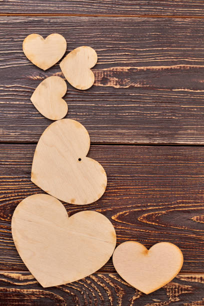istock Beautiful wooden hearts and copy space. 956360278