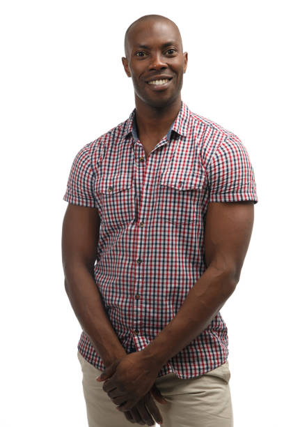 istock Black smiling man in casual clothes isolated on white background. 956362384