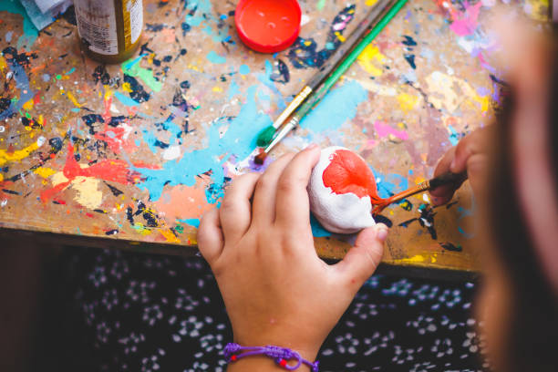 istock hand with a brush paints a figure 956362860