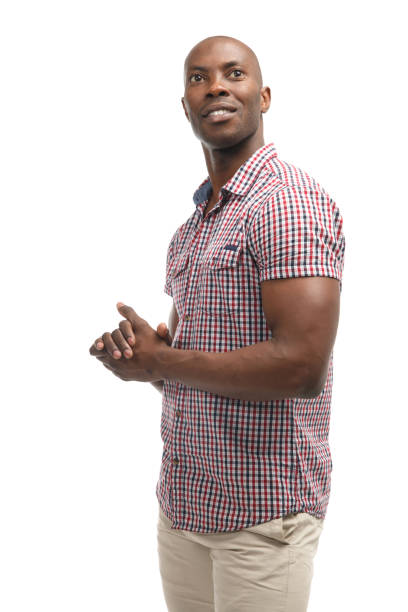 istock Black smiling man in casual clothes isolated on white background. 956363428
