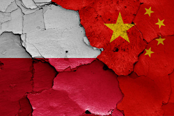 istock flags of Poland and China painted on cracked wall 956363576