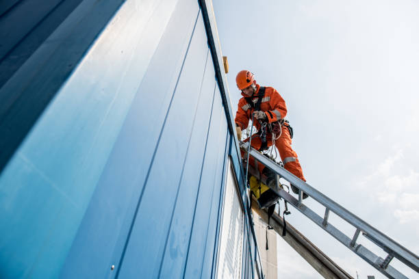 Firefighters in a rescue operation - accident on the roof stock photo