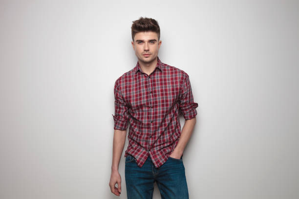 istock handsome young man with red checkers shirt and rolled sleeves 956366920