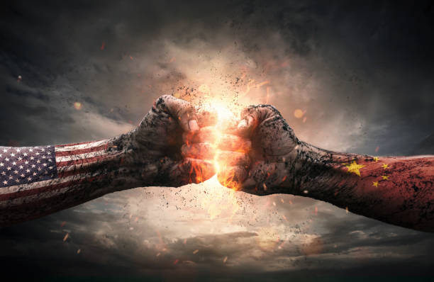 USA and China conflict concept Conflict, close up of two fists hitting each other over dramatic background with copy space confrontation photos stock pictures, royalty-free photos & images