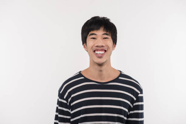 istock Cheerful Asian man looking at you 956368524