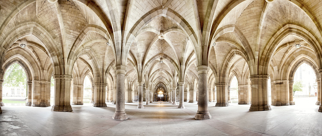 The historic Cloisters of Glasgow University. Panorama of the exterior walkway. Image taken from a public position.