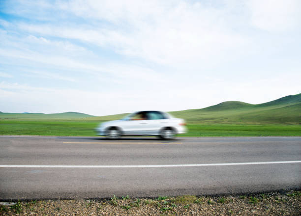istock Car driving fast on the road 956372310