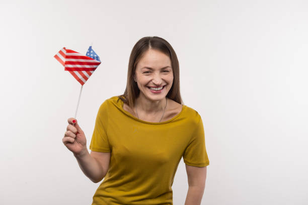 istock Joyful nice woman holding the US flag 956372930