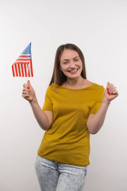 istock Positive young woman supporting her country 956372982