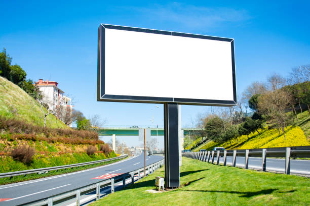istock Large blank billboard located on the side of the road. 956373852