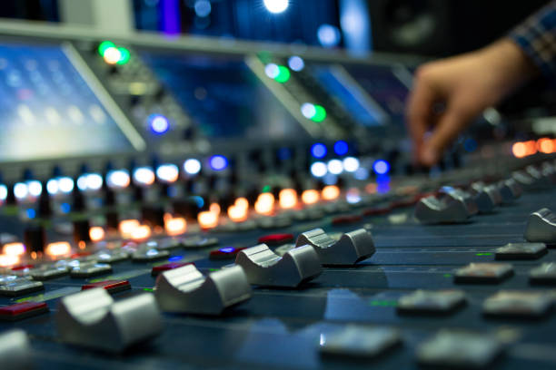 Hand on a Mixing Desk Fader in Television Gallery