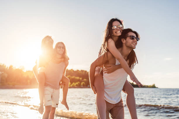 istock Group of friends on beach 956377356