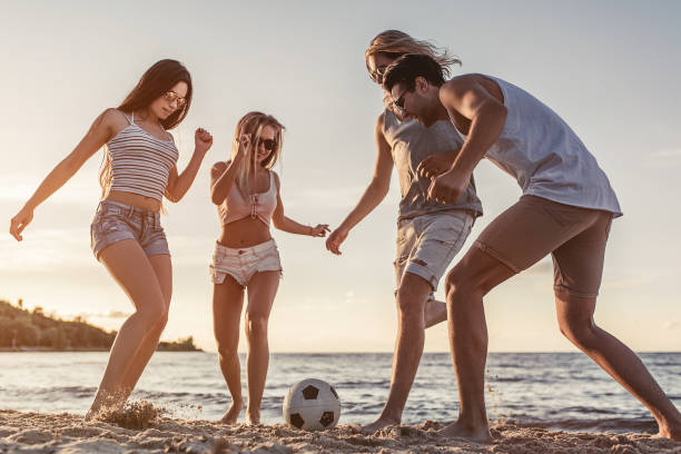 istock Group of friends on beach 956377550
