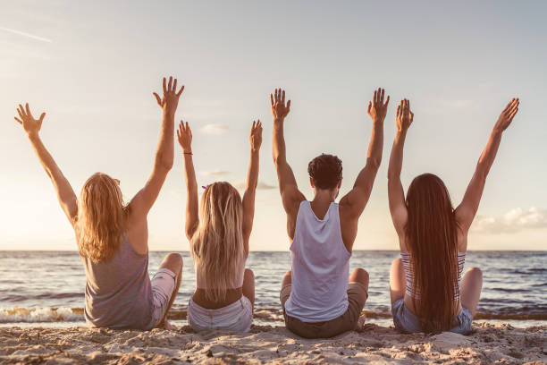 istock Group of friends on beach 956377580