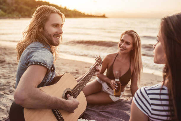 istock Group of friends on beach 956377944