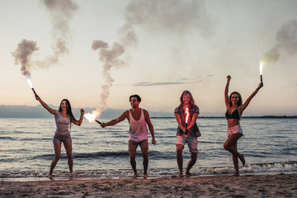 istock Group of friends on beach 956377982