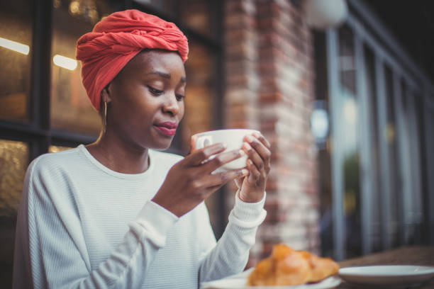 istock Black girl in cafe 956382704