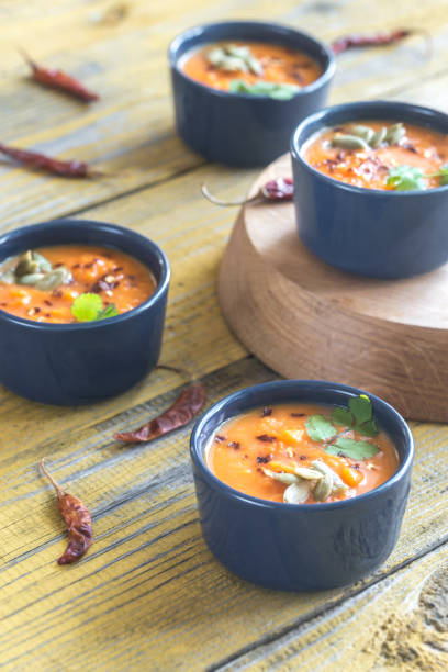 istock Bowls of pumpkin cream soup 956387720