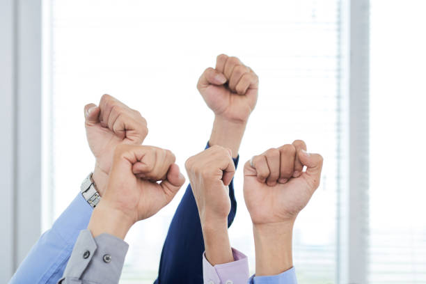 istock Managers Showing Clenched Fists 956390348