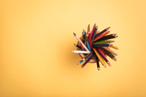 istock Top view Crayon Pencil on Yellow Background. Copy Space. 956391152