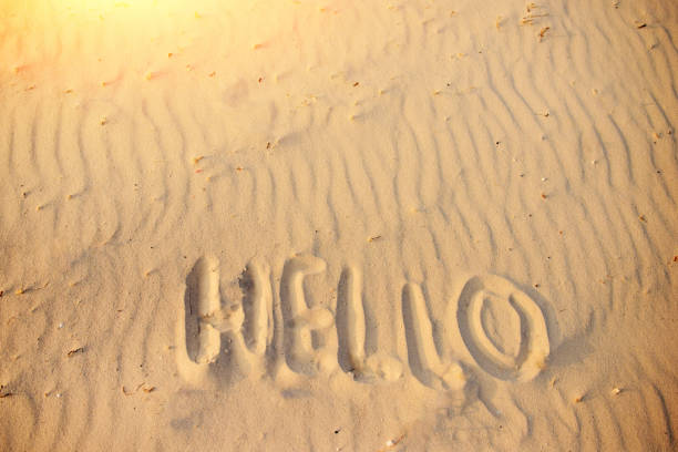istock hello on the sand, on a wonderful sunny day 956396148