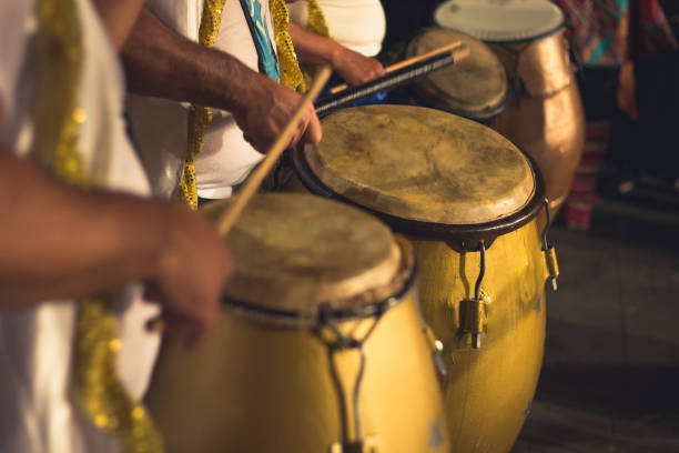 Group of men playing yellow drums at carnival parade at night Brazil batucada musicians. Party event celebration concept. Loud music performers percussion instrument stock pictures, royalty-free photos & images