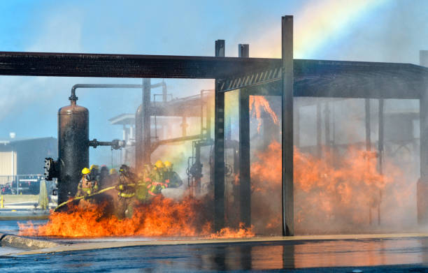 Fire fighters battling a blaze at oil pipeline refinery