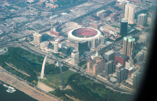 Aerial shot of Milwaukee, Wisconsin on a hazy day in Fall, looking across King Park and Interstate 43 towards the downtown skyline, with Lake Michigan in the distance.