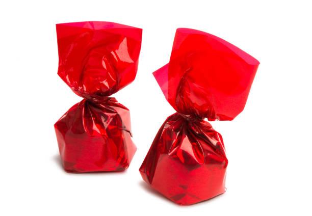 istock chocolate candies in wrapper isolated 956402404