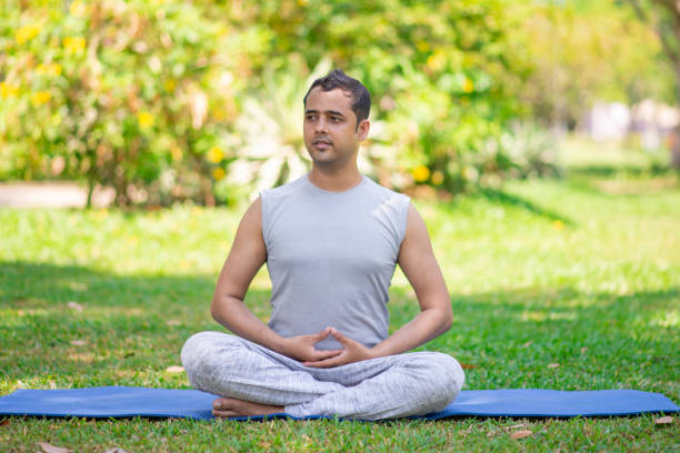 Pensive office worker starting his weekend with yoga
