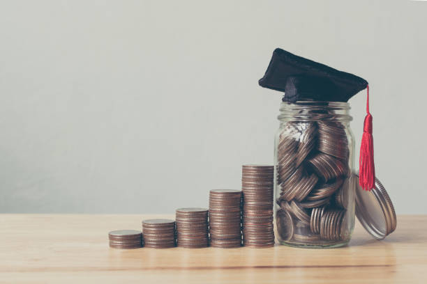 Scholarship money concept. Coins in jar with money stack step growing growth saving money investment Scholarship money concept. Coins in jar with money stack step growing growth saving money investment financial education stock pictures, royalty-free photos & images