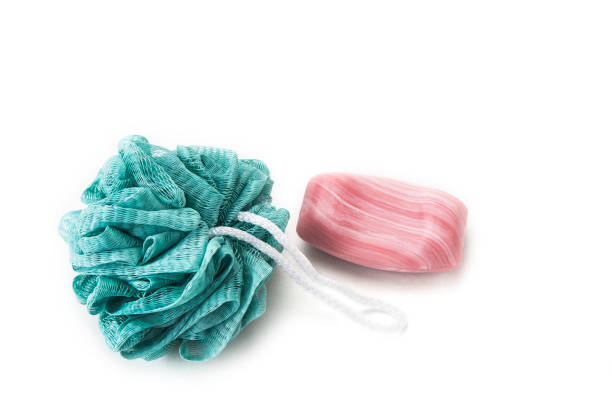 istock Bath sponges with soap and towel on the white background 956410198