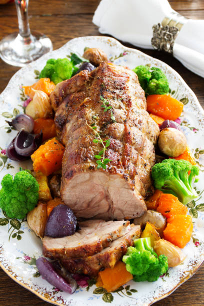 istock Roast pork with vegetables and spices. 956411454