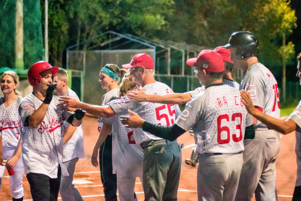 istock Softball Team Congratulating to a Player 956411514