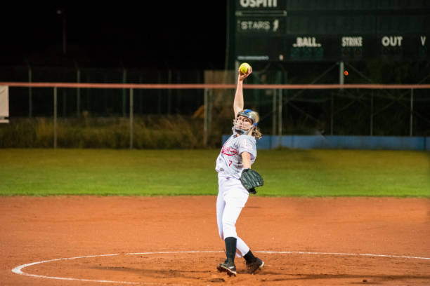 istock Woman Softball Pitcher Throwing the Ball 956411532