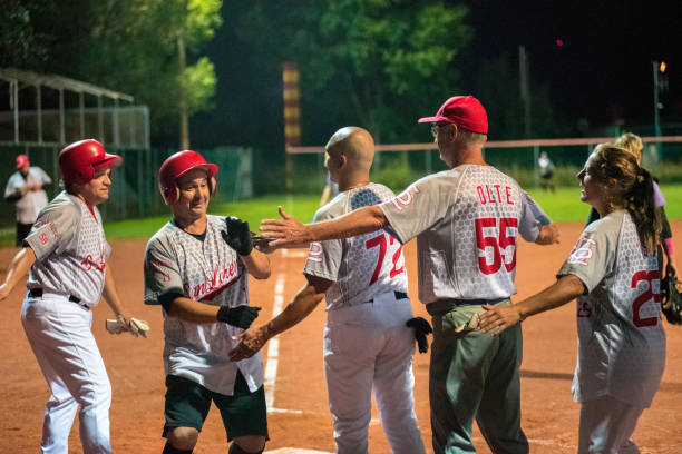 istock Softball Team Congratulating to a Player 956411554