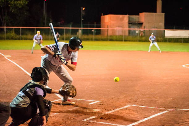 softball hitter e catcher in attesa di palla - softball baseball glove sports equipment outdoors foto e immagini stock