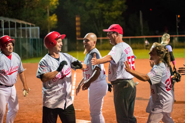 istock Softball Team Congratulating to a Player 956411570