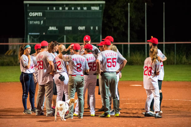istock Softball Team Having a Discussion with Coach after the Game 956411574