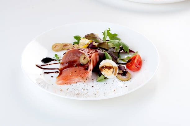 istock salmon salad greens olives lemon balsamic sauce 956414208
