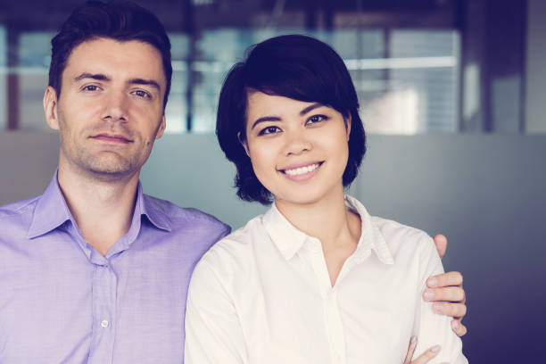 istock Confident businessman embracing smiling colleague 956414810