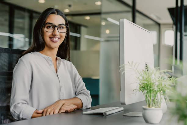 portrait of successful businesswoman in office - indiana imagens e fotografias de stock