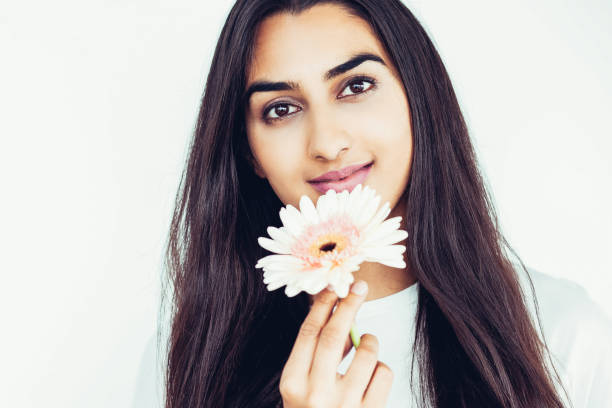 Content Pretty Indian Lady Holding Gerbera Flower Stock Photo - Download  Image Now - One Woman Only, Women, Contented Emotion - iStock
