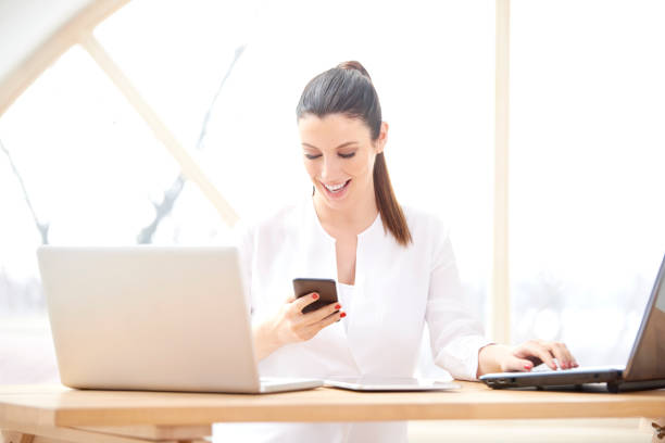 istock Businesswoman text messaging 956416392